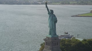 AX88_106 - 4K aerial stock footage of flying by the front of the Statue of Liberty, New York, New York