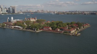 AX88_112 - 4K aerial stock footage of flying by historic Ellis Island, New York, New York