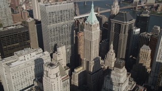 AX88_118 - 4K aerial stock footage video of approaching 40 Wall Street in Lower Manhattan, New York, New York