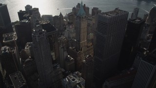 AX88_129 - 4K aerial stock footage of approaching 40 Wall Street and Lower Manhattan skyscrapers, New York, New York