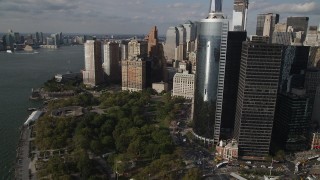 AX88_146 - 4K aerial stock footage fly over Battery Park with view of Lower Manhattan skyscrapers, New York, New York