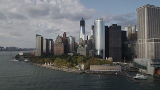 AX88_163 - 4K stock footage aerial video of Freedom Tower, seen while flying by Battery Park, Lower Manhattan, New York