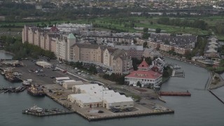 AX88_196 - 4K aerial stock footage of flying by waterfront condominium complexes, Port Liberte, New Jersey