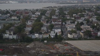 AX88_197 - 4K aerial stock footage of approaching urban residential neighborhoods, Jersey City, New Jersey