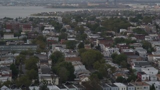 AX88_198 - 4K aerial stock footage of flying by urban residential neighborhoods, Jersey City, New Jersey