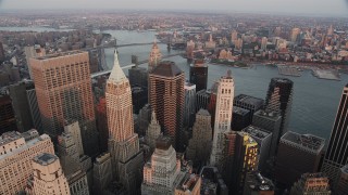 AX89_006 - 4K aerial stock footage Flying over Lower Manhattan, approaching Wall Street, New York, New York, sunset