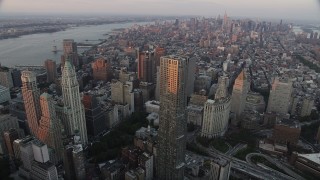 AX89_007 - 4K aerial stock footage Flying by Lower Manhattan,8 Spruce Street, New York, New York, sunset