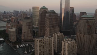 AX89_023 - 4K aerial stock footage of World Trade Center Memorial, Two World Trade Center, Lower Manhattan, New York, sunset