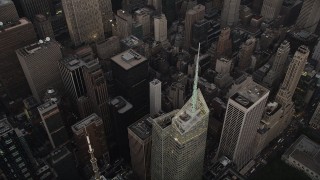 AX89_054 - 4K aerial stock footage Approaching Bank of America Tower, Midtown Manhattan, New York, twilight