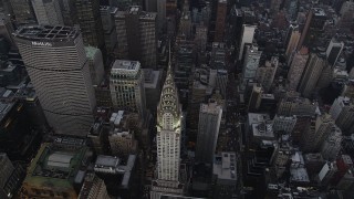 AX89_063 - 4K aerial stock footage Bird's eye view of Chrysler Building, Midtown Manhattan, New York, twilight