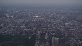 AX89_067 - 4K aerial stock footage Flying by Yankee Stadium, Central Park, New York, New York, twilight