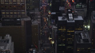 AX89_072 - 4K aerial stock footage Fly over 7th Avenue, reveal Times Square, Midtown Manhattan, New York, twilight