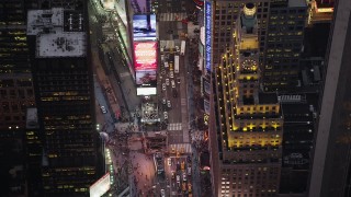 AX89_075 - 4K aerial stock footage Bird's eye view over Times Square, Midtown Manhattan, New York, twilight