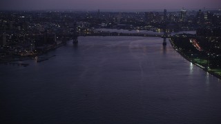 AX89_115 - 4K aerial stock footage Approaching Williamsburg Bridge, East River, New York, New York, twilight