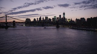 AX89_121 - 4K aerial stock footage Approaching Lower Manhattan, Manhattan Bridge, New York, New York, twilight