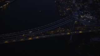 AX89_125 - 4K aerial stock footage Flying by Manhattan Bridge, Brooklyn, New York, New York, sunset