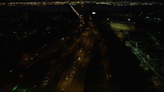 AX89_152 - Aerial stock footage of New Jersey Turnpike Extension, Newark Bay Bridge, Newark, New Jersey, night