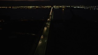 AX89_153 - 4K aerial stock footage Flying by Newark Bay Bridge, Newark, New Jersey, night