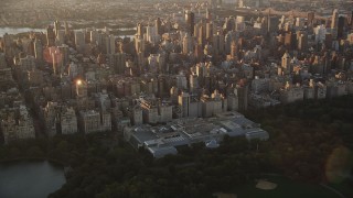 AX90_041 - 4K aerial stock footage Flying by the Metropolitan Museum of Art, New York, New York, sunrise