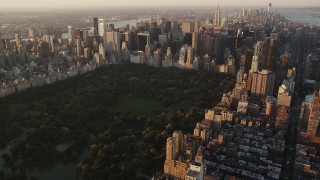 AX90_043 - 4K stock footage aerial video Flying by Central Park, Midtown Manhattan, New York, New York, sunrise