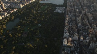 AX90_080 - 4K aerial stock footage Flying over Central Park, Metropolitan Museum of Art, New York, sunrise