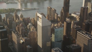 AX90_083 - 4K aerial stock footage Flying by Citigroup Center in Midtown Manhattan, New York, New York, sunrise
