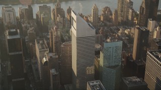 AX90_084 - 4K aerial stock footage Flying by Citigroup Center, Midtown Manhattan, New York, New York, sunrise