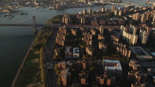 AX90_094 - 4K aerial stock footage of Public housing, Lower East Side, Williamsburg Bridge, New York, sunrise