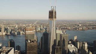 AX90_117 - 4K aerial stock footage of Freedom Tower, One World Trade Center, Lower Manhattan, New York, sunrise