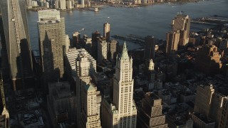 AX90_118 - 4K aerial stock footage Flying by Woolworth Building, Lower Manhattan, New York, New York, sunrise