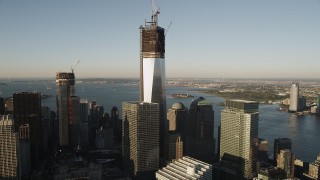 AX90_121 - 4K aerial stock footage of Freedom Tower, One World Trade Center, Lower Manhattan, New York, sunrise