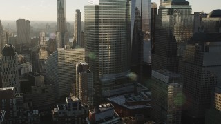 AX90_123 - 4K aerial stock footage Flying by the World Trade Center, Lower Manhattan, New York, New York, sunrise