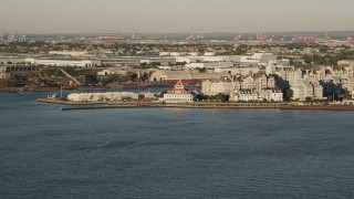AX90_144 - 4K aerial stock footage Approaching condominiums, Port Liberte, Jersey City, New Jersey, sunrise