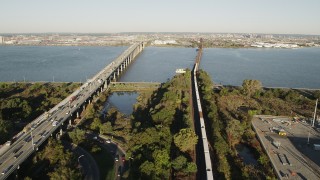 AX90_168 - 4K aerial stock footage of Lehigh Valley Railroad Bridge, Newark Bay Bridge, Newark, New Jersey, sunrise