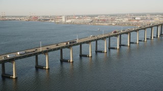 AX90_169 - 4K aerial stock footage of Newark Bay Bridge, Lehigh Valley Railroad Bridge, Newark, New Jersey, sunrise
