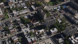 AX91_022 - 4K aerial stock footage of a bird's eye view of apartment buildings and row houses in The Bronx, New York, New York