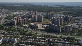 AX91_025 - 4K aerial stock footage of approaching Harry S. Truman High School and Co-op City apartment buildings, The Bronx, New York