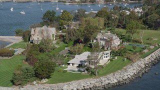 AX91_037 - 4K aerial stock footage of flying by oceanfront mansions, Mamaroneck, New York