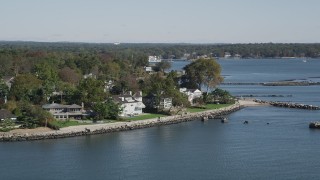 AX91_038 - 4K aerial stock footage of passing by oceanfront mansions, Mamaroneck, New York