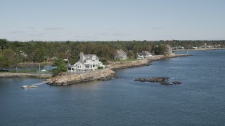 AX91_046 - 4K aerial stock footage of flying by oceanside mansions, Rye, New York
