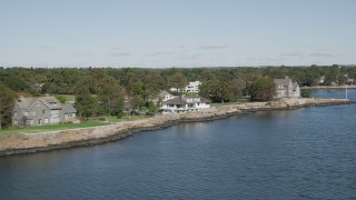 AX91_047 - 4K aerial stock footage of a row of oceanfront mansions, Rye, New York