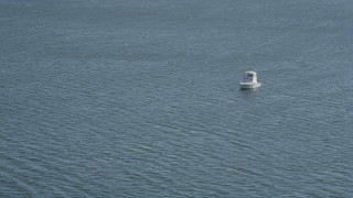 AX91_054 - 4K aerial stock footage of flying by a fishing boat, Long Island Sound, New York