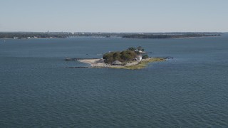 AX91_059 - 4K aerial stock footage video of approaching an oceanfront, island home, Island Beach, Connecticut