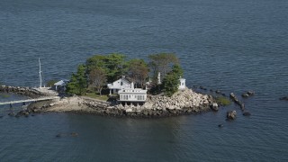 AX91_061 - 4K aerial stock footage of passing an isolated island home, Island Beach, Connecticut
