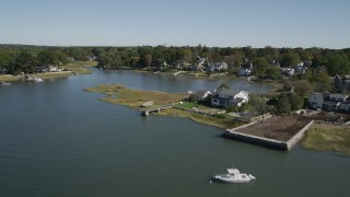 AX91_066 - 4K aerial stock footage of tilting up to reveal oceanfront homes, Greenwich, Connecticut