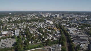 AX91_071 - 4K aerial stock footage of following railroad tracks to approach Downtown Stamford, Connecticut