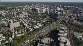 AX91_073 - 4K aerial stock footage of tilting from hotel to reveal office buildings in Downtown Stamford, Connecticut
