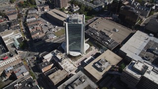 AX91_077 - 4K aerial stock footage of approaching an office building, tilt to bird's eye view in Downtown Stamford, Connecticut