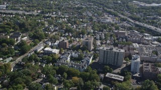 AX91_078 - 4K aerial stock footage of flying by apartment buildings and suburban homes, Stamford, Connecticut