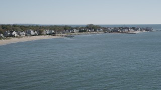 AX91_108 - 4K aerial stock footage of approaching beachfront homes in Fairfield, Connecticut
